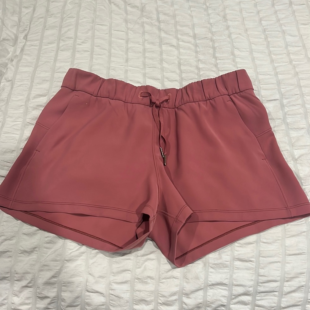 Rose color Lulu shorts size 10 I think.
